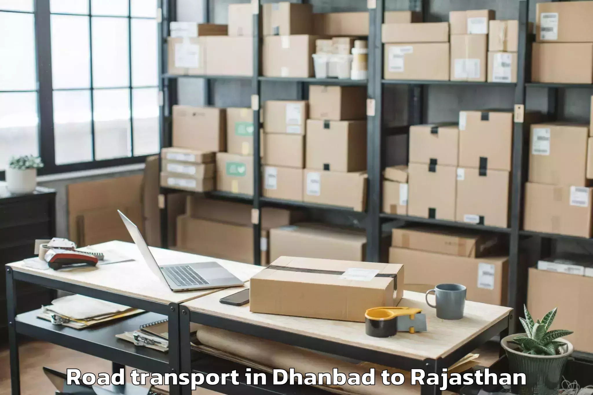 Book Dhanbad to Hindoli Road Transport Online